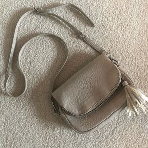 Moda Luxe tan cross body with tassel